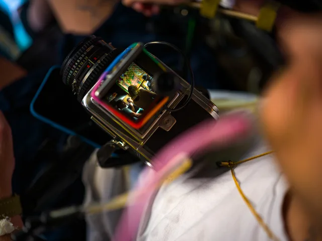 Close-up of a camera screen displaying a small portrait.